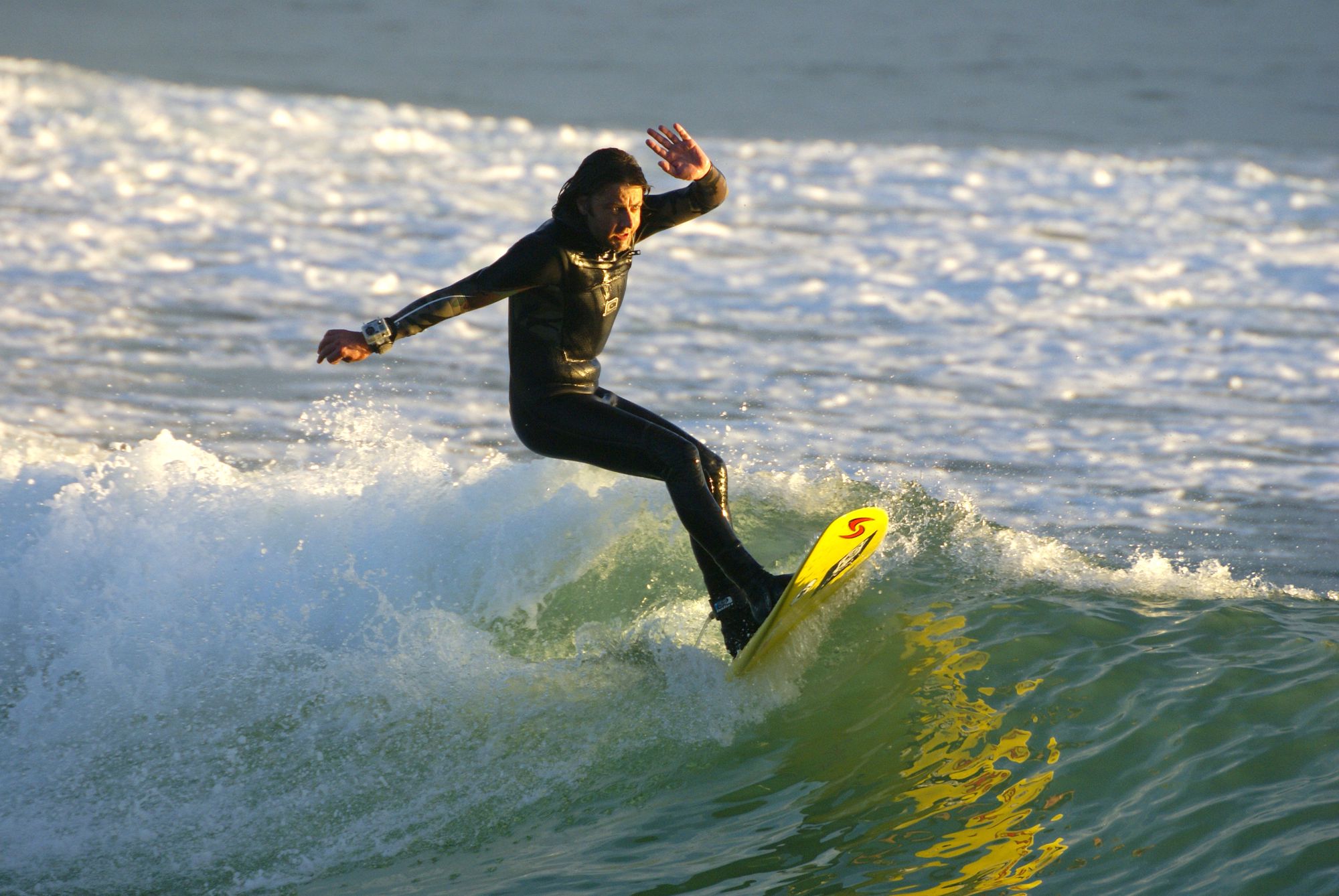 Surfing in Wales. Good at surfing.