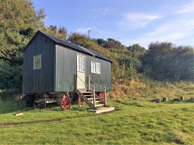 An authentic shepherd&#39;s hut in Kent, restored from the 1890s and kitted out for couples with a king-sized bed, wood-burning stove and views over the Kent Downs.