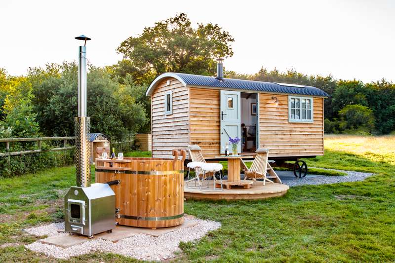A stunning luxury shepherds hut with wood-fired hot tub near the New Forest National Park. 