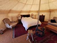Lotus belle tent on a medieval moat in Norfolk