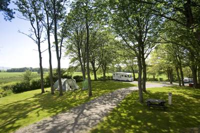 Located within six acres of mature Cumbrian woodlands, yet only 500 meters from the seafront.