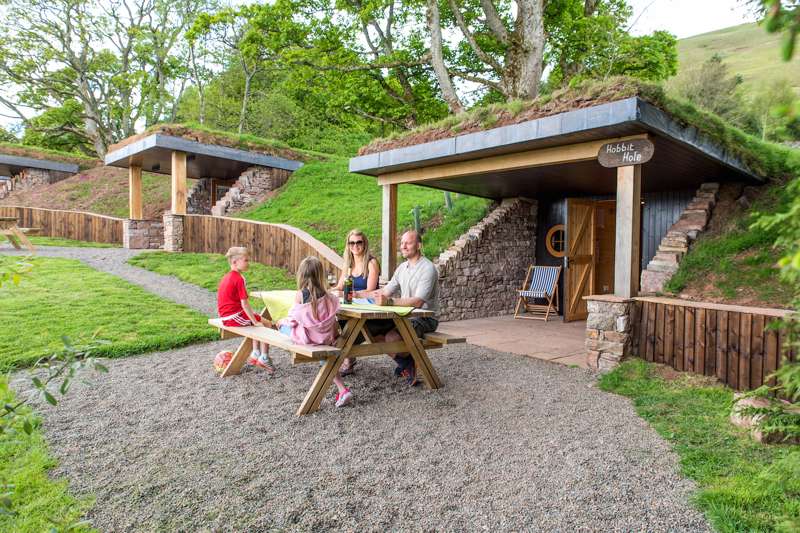 Family glamping in the hobbit holes at The Quiet Site, an eco-friendly campsite near Ullswater in Cumbria