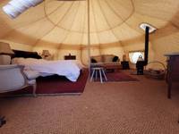 Lotus belle tent on a medieval moat in Norfolk